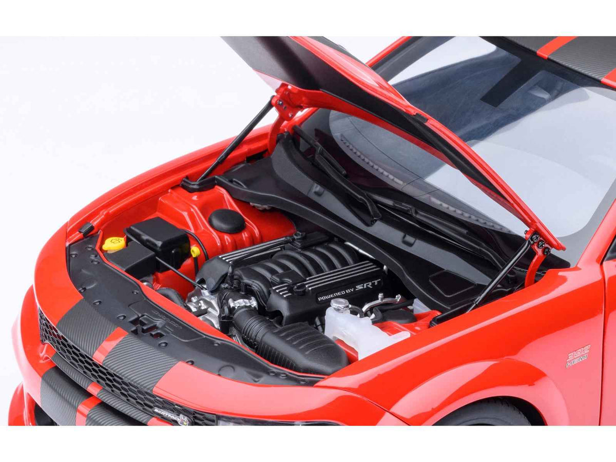 Miniature Dodge Charger Scat Pack Widebody Torred model car with carbon stripes by Autoart, detailed 1/18 scale collectible.