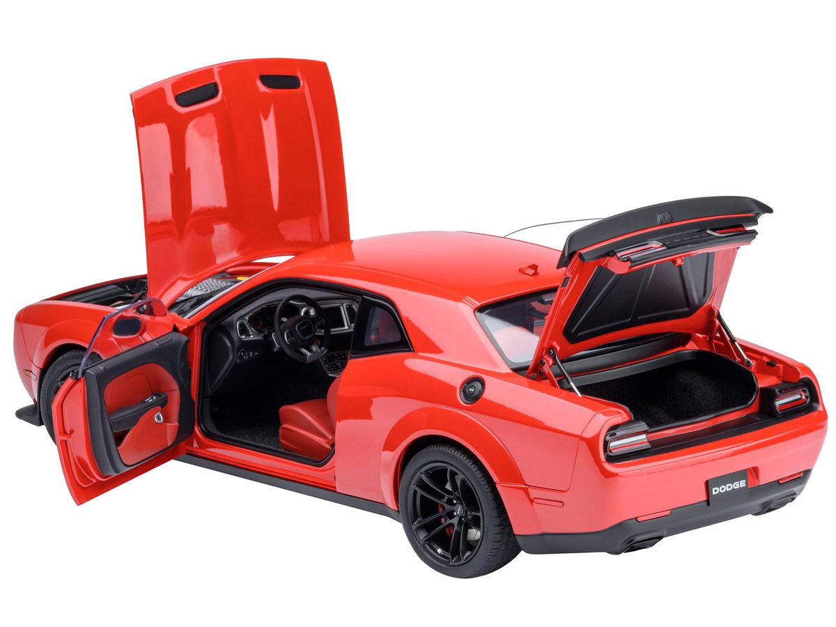 Miniature Dodge Challenger SRT Jailbreak Torred model car by Autoart, featuring red interior and detailed 1/18 scale.