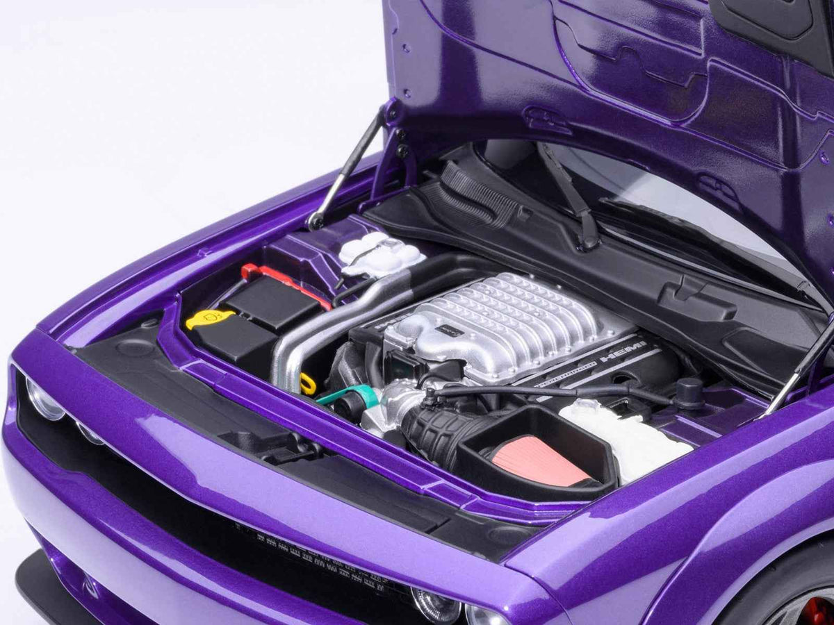 Miniature Dodge Challenger SRT Super Stock model car in Plum Crazy purple, 1/18 scale by Autoart, detailed collectible vehicle.