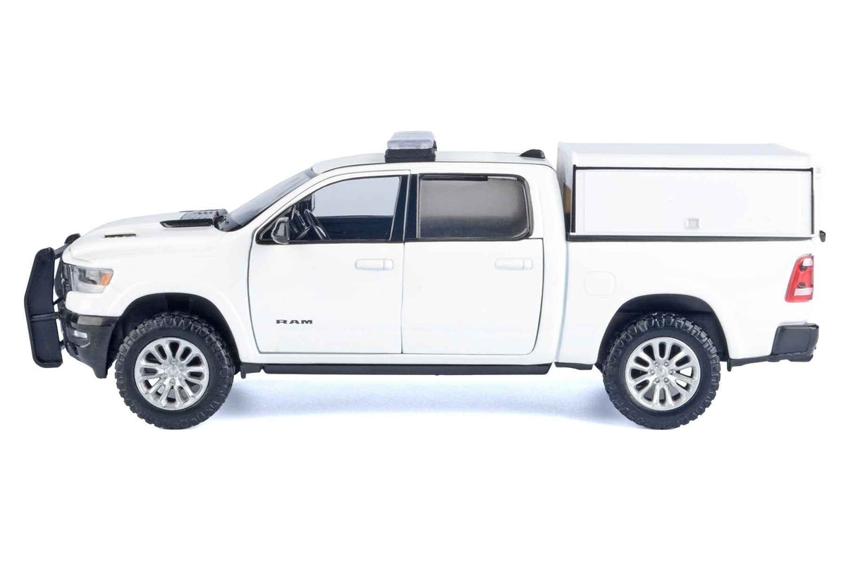 White 2019 RAM 1500 Laramie Crew Cab pickup truck diecast model by Miniature Motors, detailed with truck bed camper, scale 1/27.