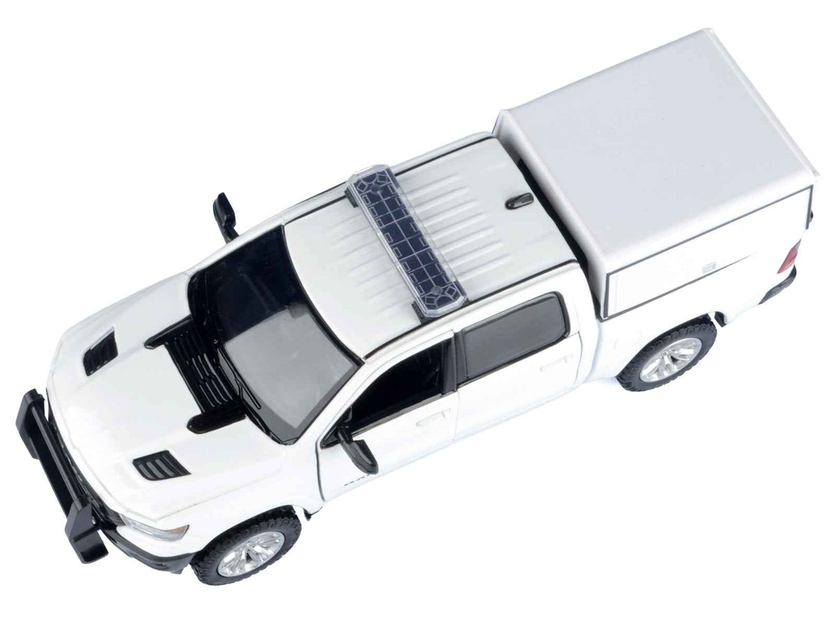 White 2019 RAM 1500 Laramie Crew Cab diecast model truck with truck bed camper, by Miniature Motors, part of the Custom Builder's Kit series.