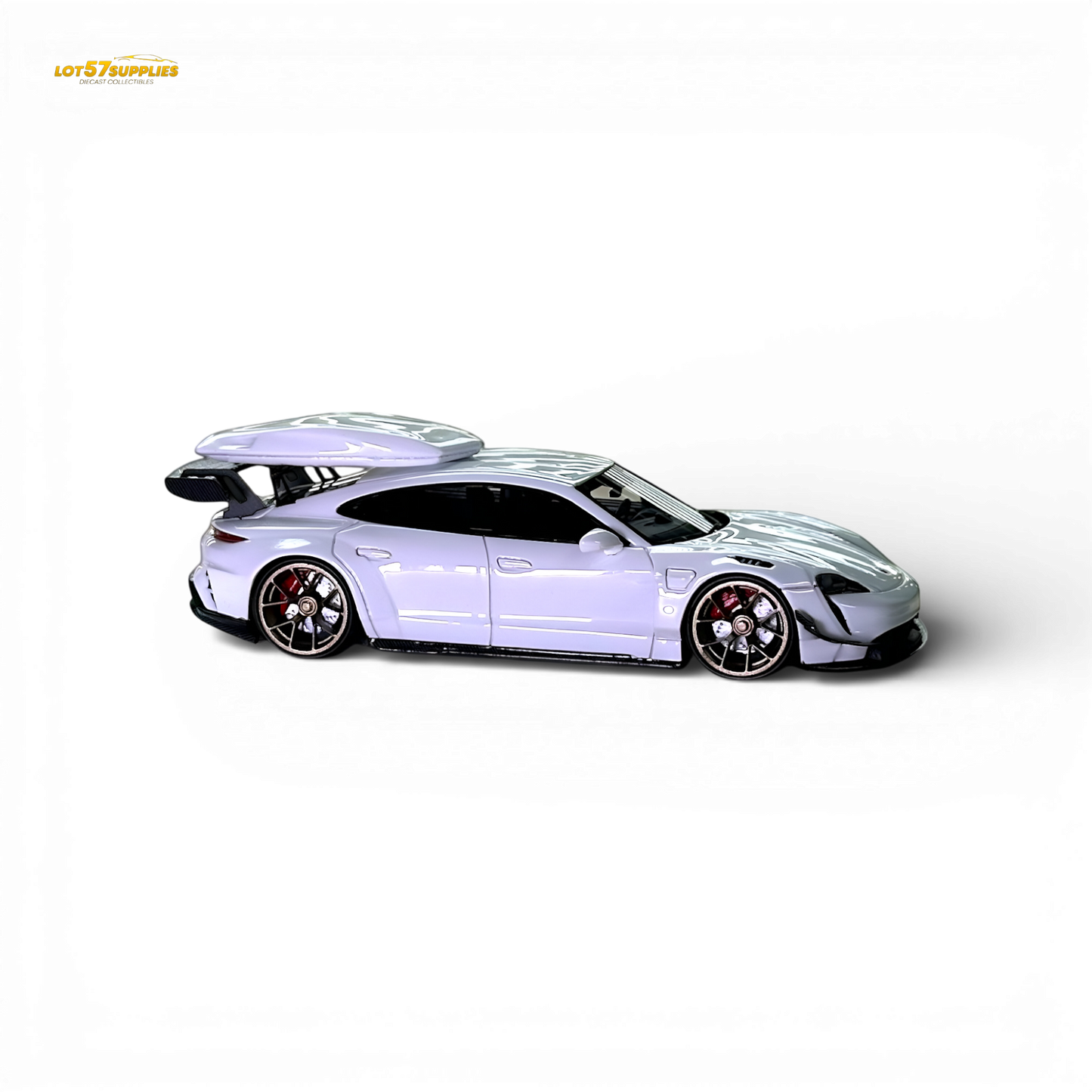 White Porsche Taycan diecast model with roof box, 1:64 scale, detailed miniature car from Lot57Supplies Diecast Shop.