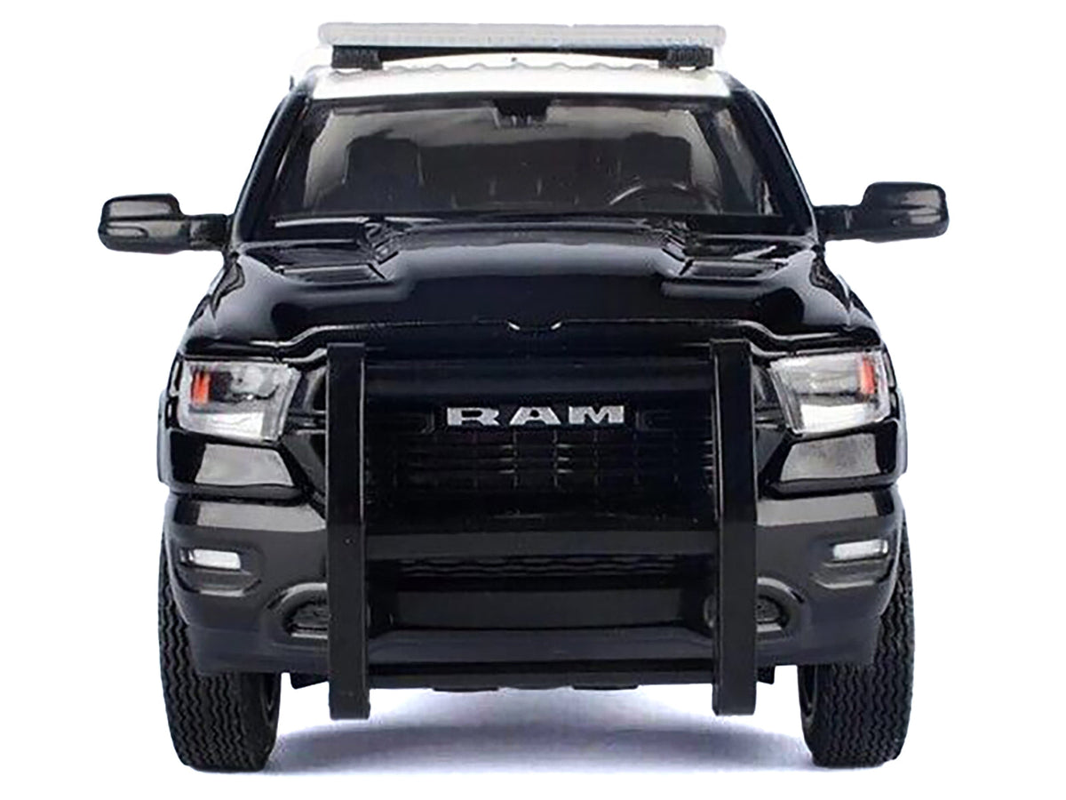Miniature Motors RAM 1500 Laramie Crew Cab Pickup Truck diecast model in black and white with California Highway Patrol decals