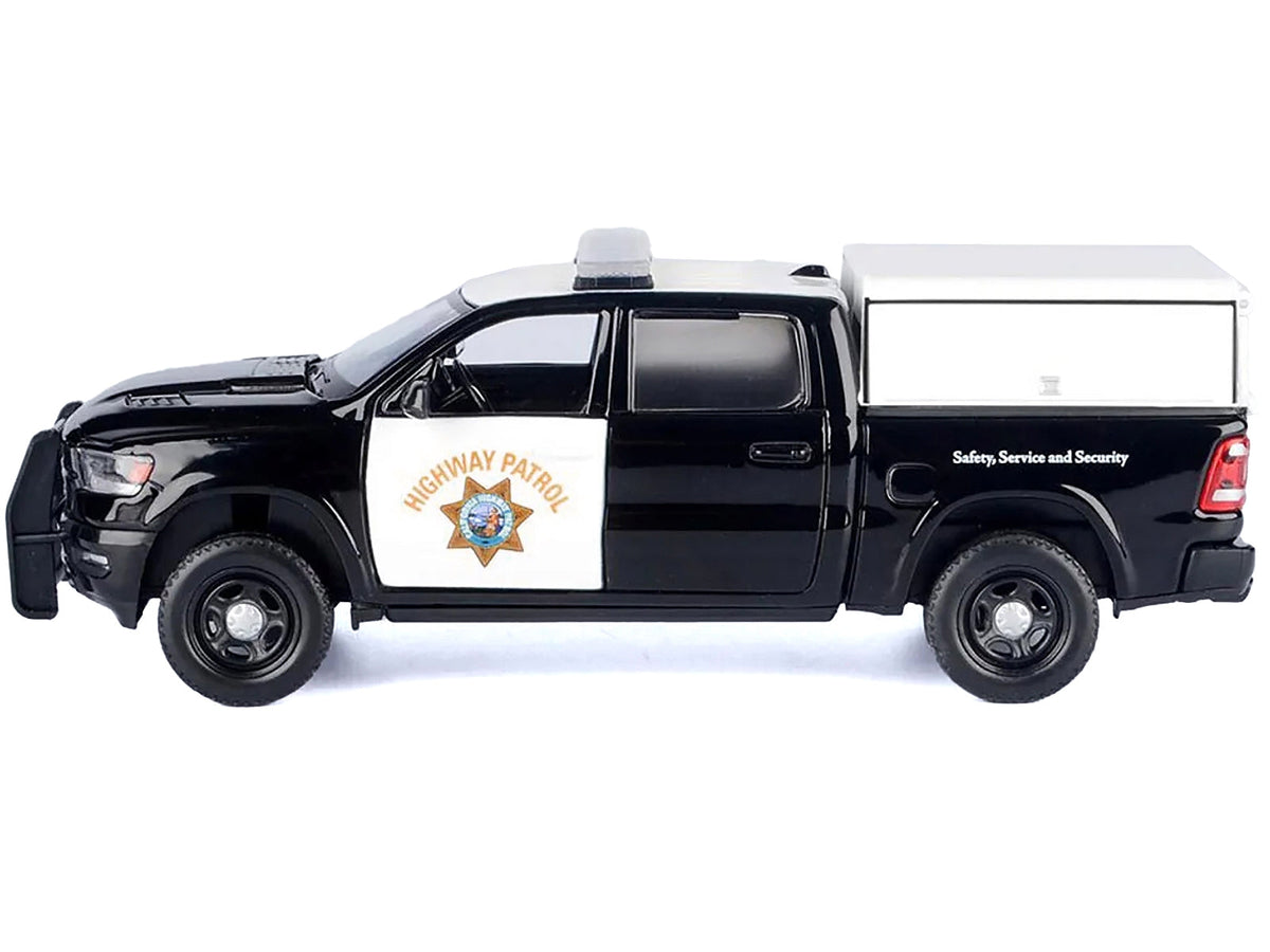 Black and white 2019 RAM 1500 Laramie Crew Cab diecast model truck by Miniature Motors, featuring California Highway Patrol design.