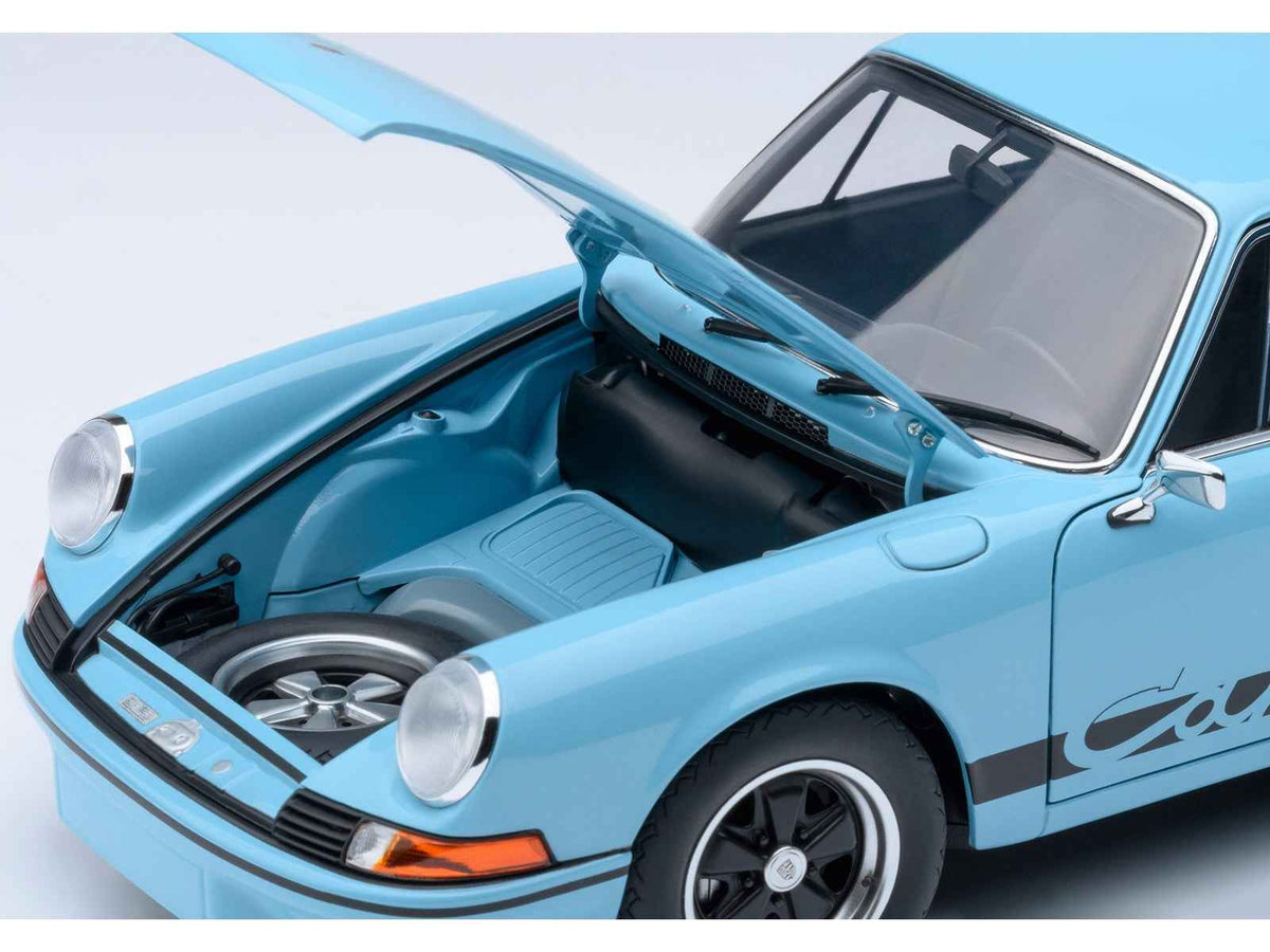 Miniature Porsche 911 Carrera 2.7 RS model car in Gulf Blue with black stripes and wheels, detailed 1/18 scale by Autoart.