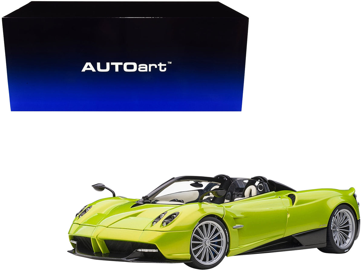 Miniature Pagani Huayra Roadster model car in Verde Firenze green metallic with carbon details and luggage set, 1/18 scale by Autoart.