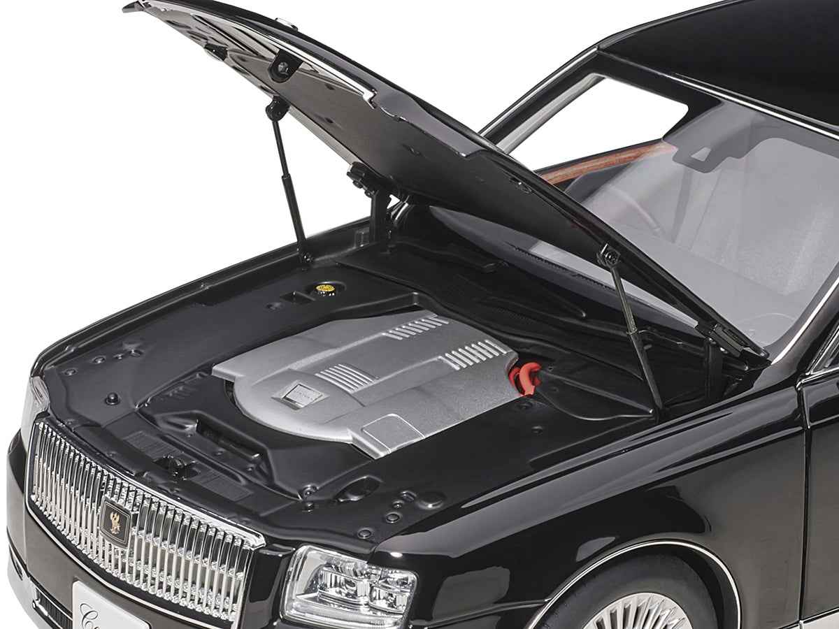 Black Toyota Century RHD model car with curtains, 1/18 scale, by Autoart, showcasing detailed exterior and interior features.