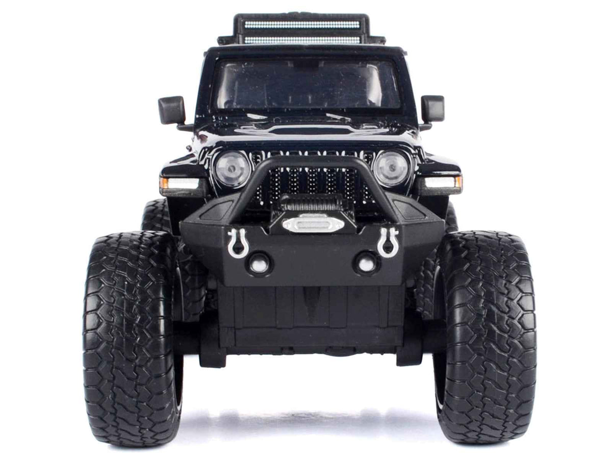 Black 2021 Jeep Gladiator Rubicon off-road diecast model truck with matte black top, detailed miniature by Miniature Motors.