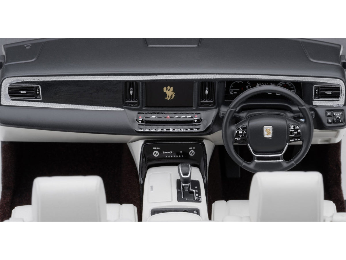 Black Toyota Century convertible model car with white interior, right-hand drive, 1/18 scale, by Autoart, detailed miniature vehicle.