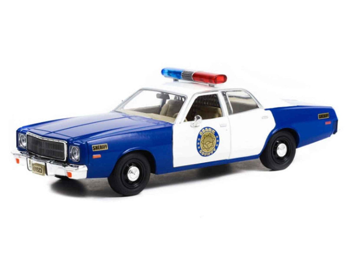 Blue and white 1/24 diecast Plymouth Fury "Osage County Sheriff" model car by Greenlight, detailed miniature collectible.