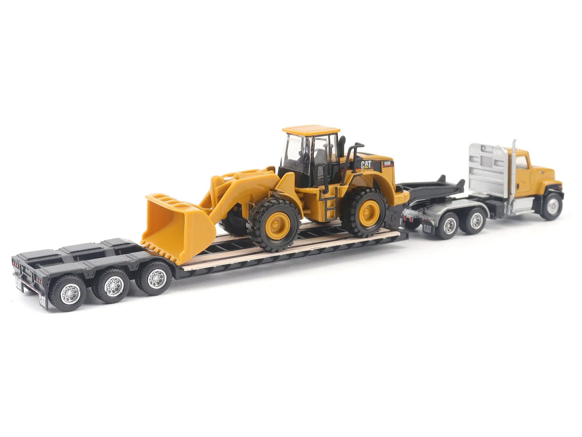 Yellow CAT Caterpillar CT681 day cab tractor with lowboy trailer and CAT 950G wheel loader diecast models in 1/87 scale by Miniature Motors.