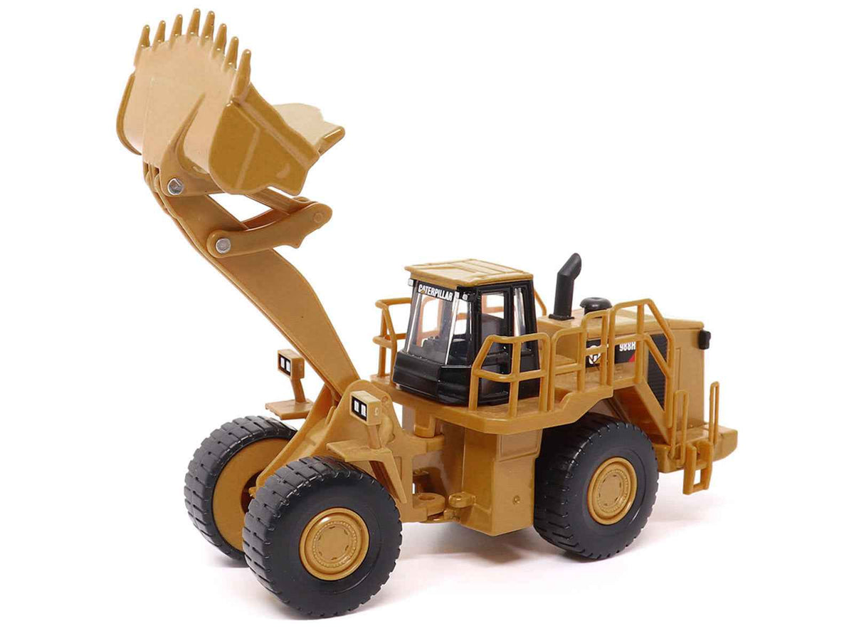 Yellow CAT Caterpillar 988H wheel loader diecast model by Diecast Masters, detailed construction model in 1/64 scale.