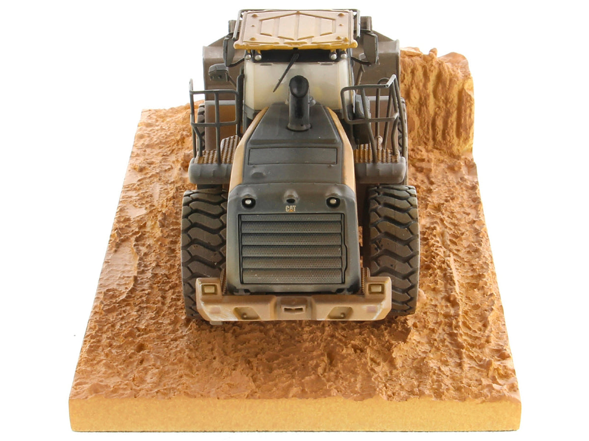 Weathered CAT Caterpillar 966M wheel loader diecast model by Diecast Masters, detailed construction model in 1/50 scale.