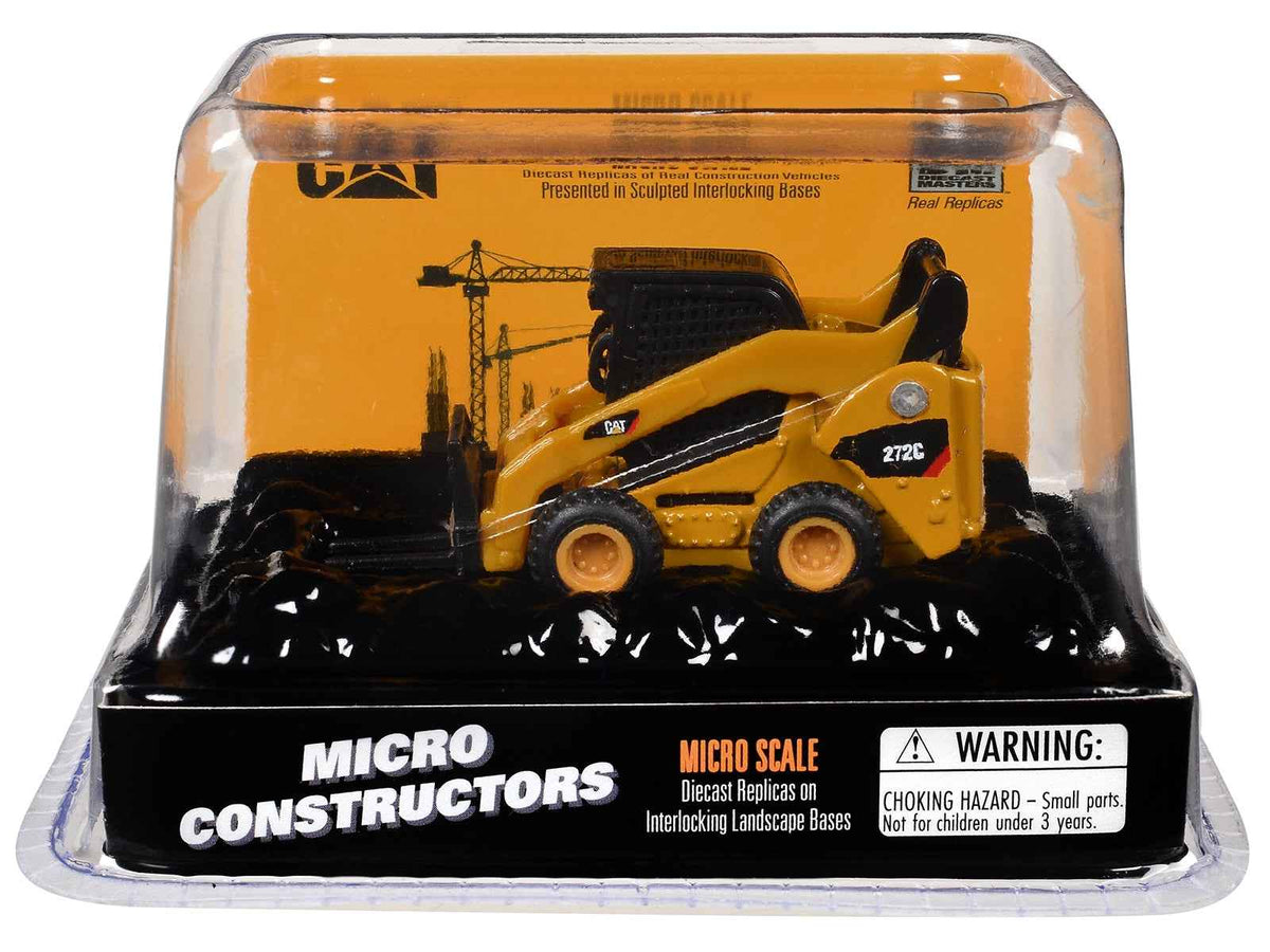 Yellow CAT Caterpillar 272C Skid Steer Loader diecast model with pallet fork from Miniature Motors' Micro-Constructor series.