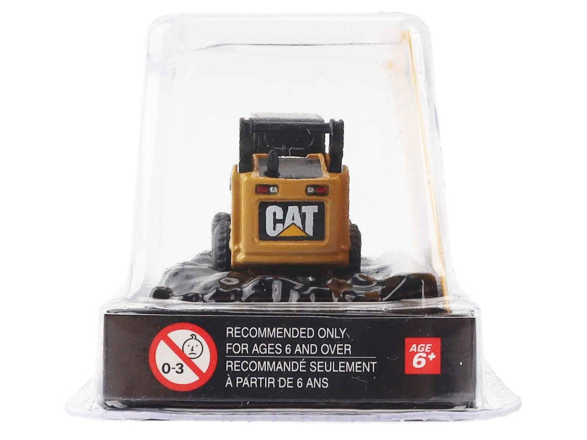 Yellow CAT Caterpillar 272C skid steer loader diecast model with pallet fork from Miniature Motors' Micro-Constructor series.