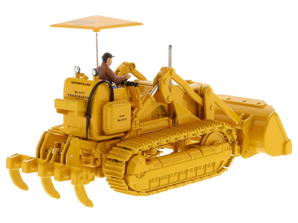Yellow CAT Caterpillar 977D Traxcavator vintage diecast model by Diecast Masters, detailed construction model with operator.