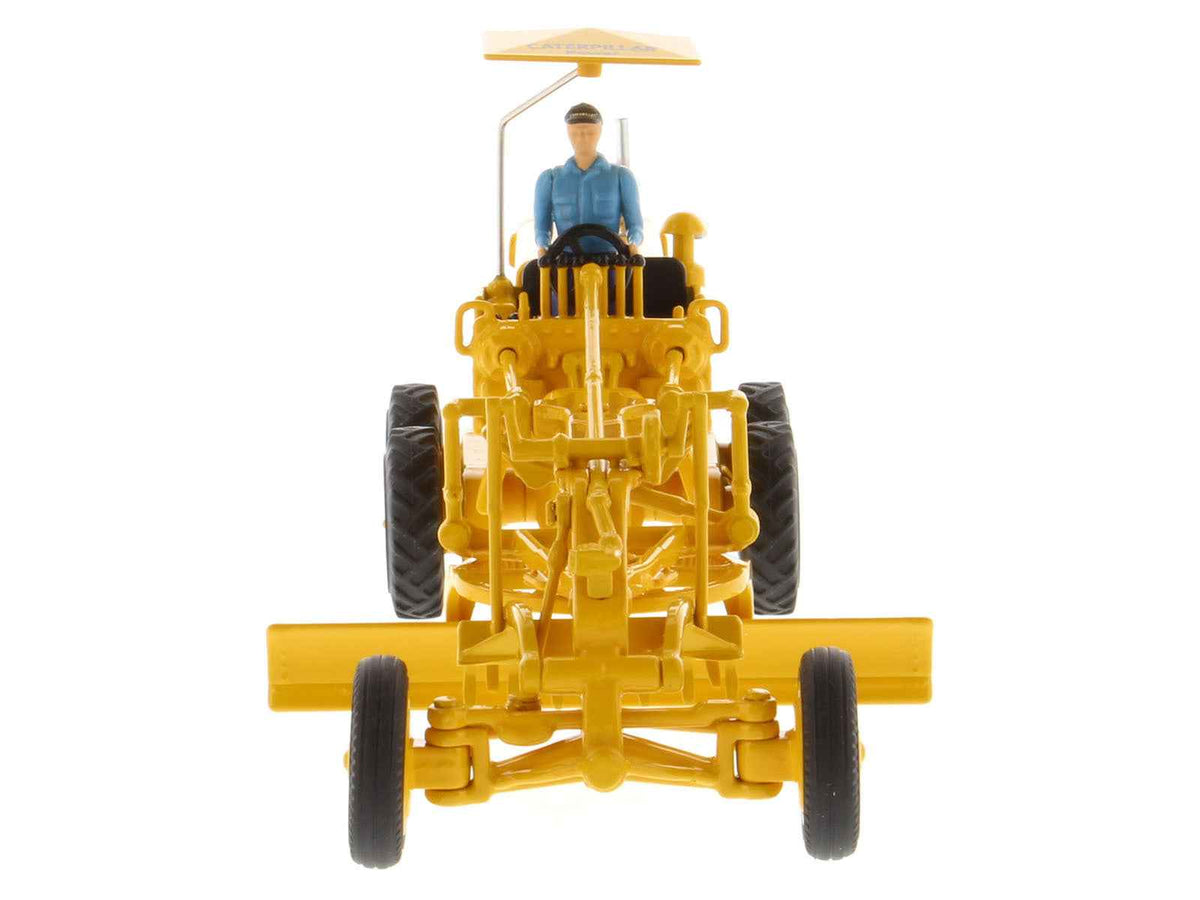 Vintage Cat Caterpillar No.12 Motor Grader yellow diecast model by Miniature Motors in 1/50 scale with operator figure.