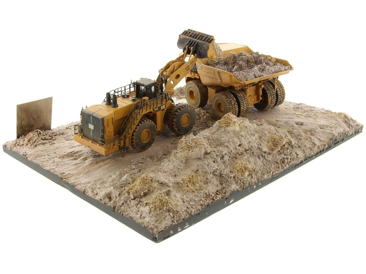 Weathered yellow CAT Caterpillar 994K wheel loader and 797 mining truck diecast models by Miniature Motors, set of 2.