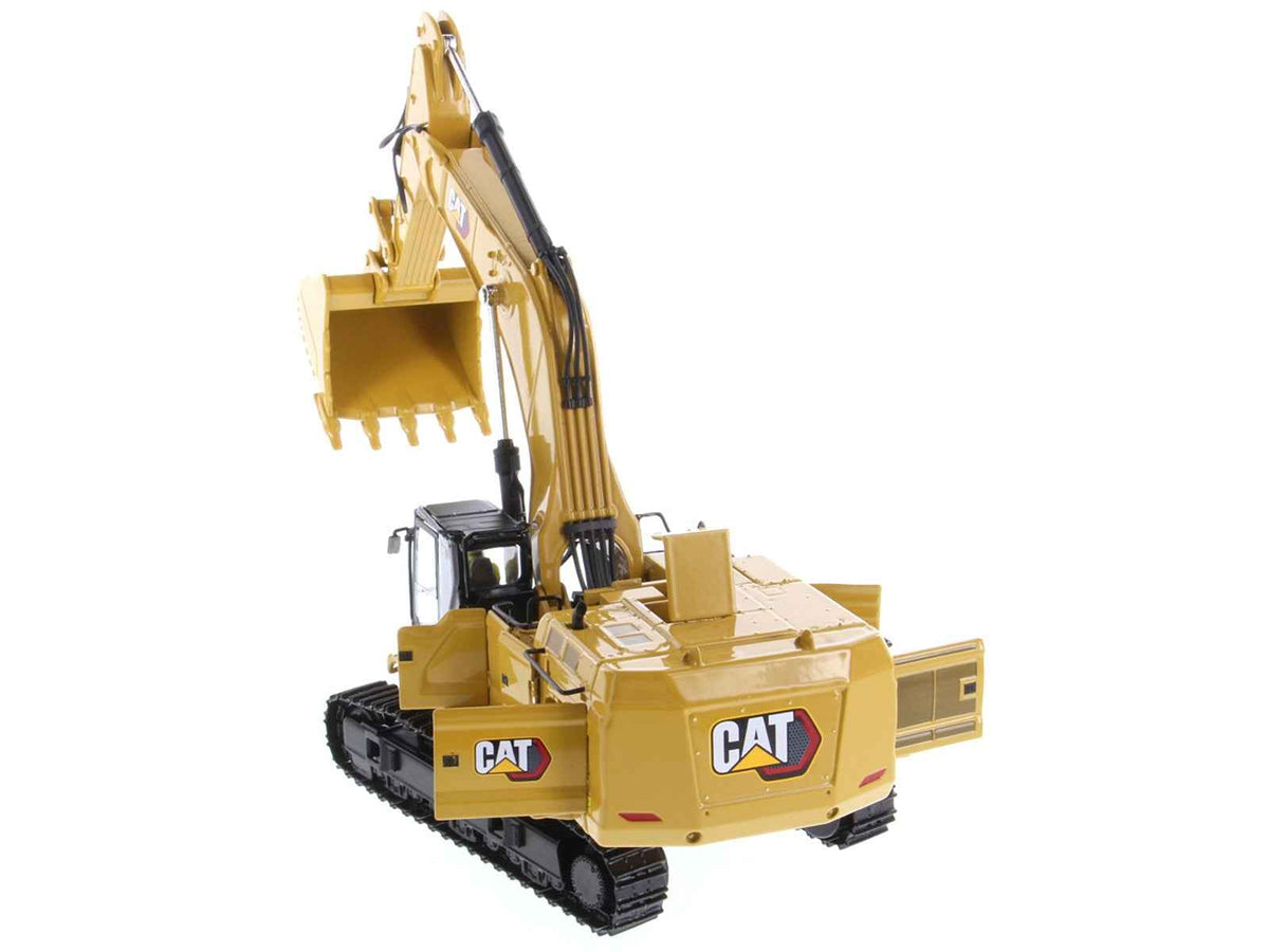 Yellow CAT Caterpillar 395 Next Generation hydraulic excavator diecast model by Miniature Motors, detailed construction replica.