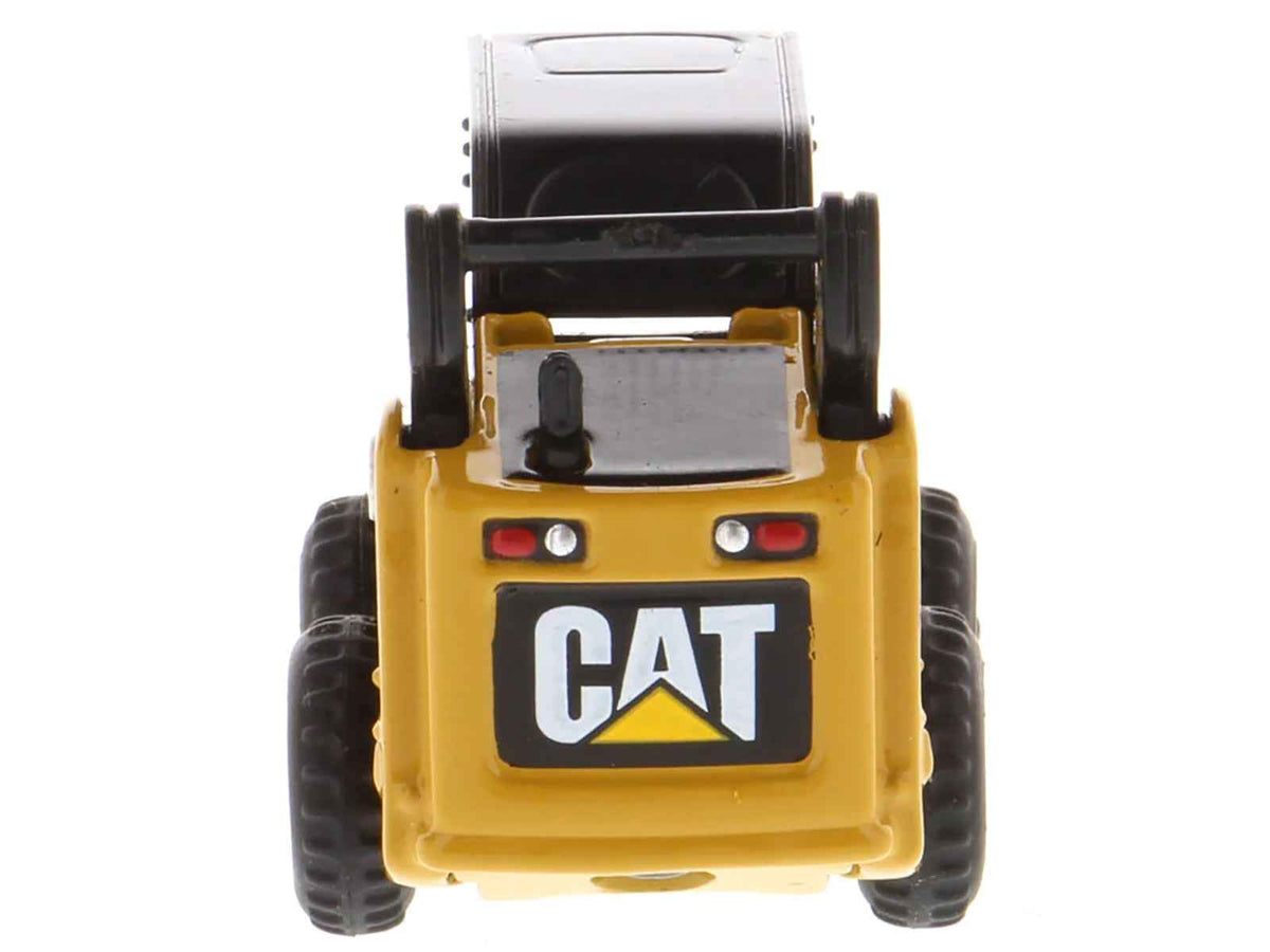 Yellow CAT 272C Skid Steer Loader diecast model from Miniature Motors' Micro-Constructor series, detailed construction toy.