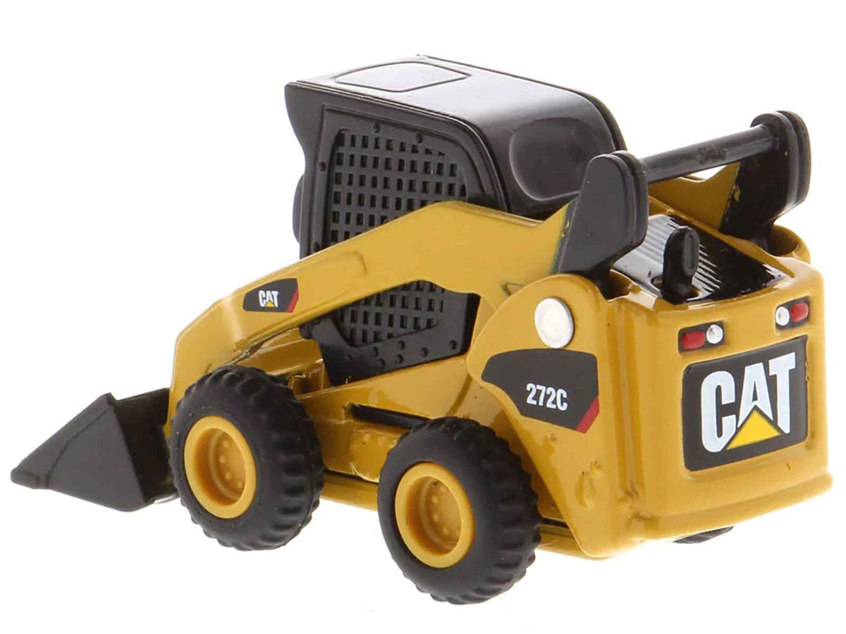 Yellow CAT Caterpillar 272C skid steer loader diecast model from Micro-Constructor series by Diecast Masters, detailed construction model.
