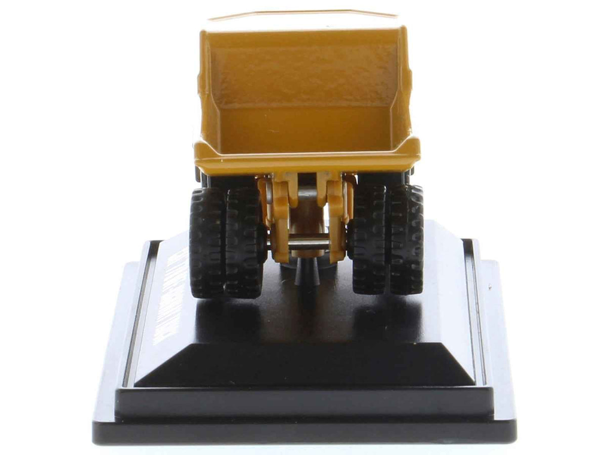Yellow CAT Caterpillar 770 Off-Highway Truck diecast model from Miniature Motors' Micro-Constructor series, detailed construction vehicle.