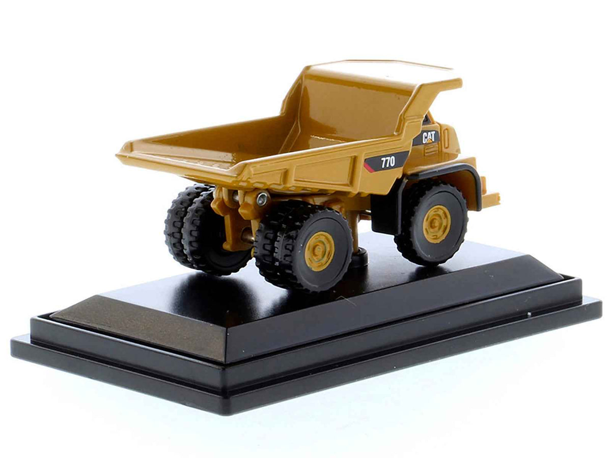 Miniature yellow CAT Caterpillar 770 off-highway truck diecast model from Diecast Masters Micro-Constructor series.