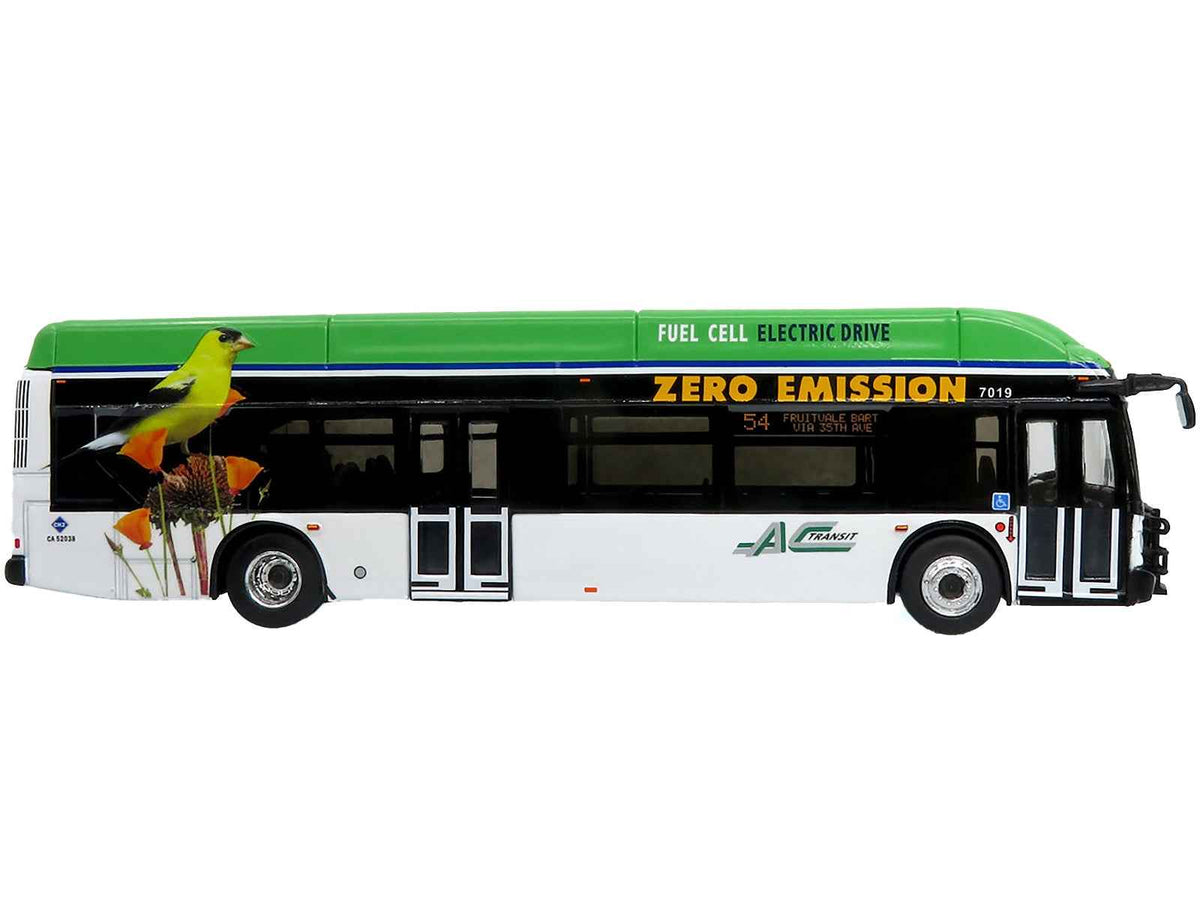 Miniature Motors New Flyer Xcelsior XHE40 transit bus diecast model in white and green with graphics, limited edition HO scale collectible.