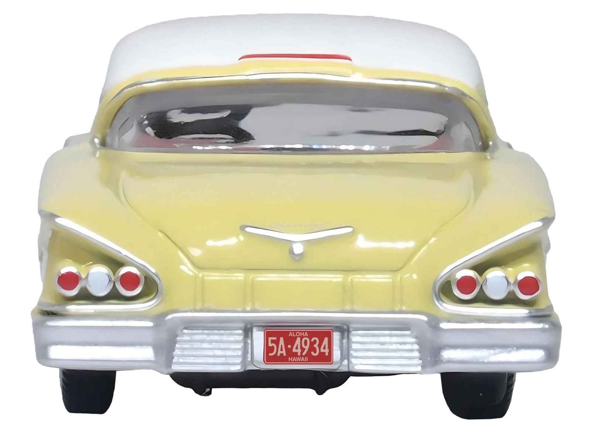 Miniature Chevrolet 1958 Impala Sport diecast model car in colonial cream with white top, on HO scale by Oxford Diecast.