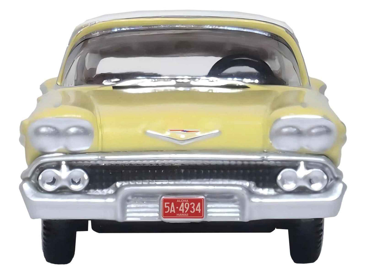 HO scale diecast model of 1958 Chevrolet Impala Sport in colonial cream with white top by Oxford Diecast, detailed miniature car.