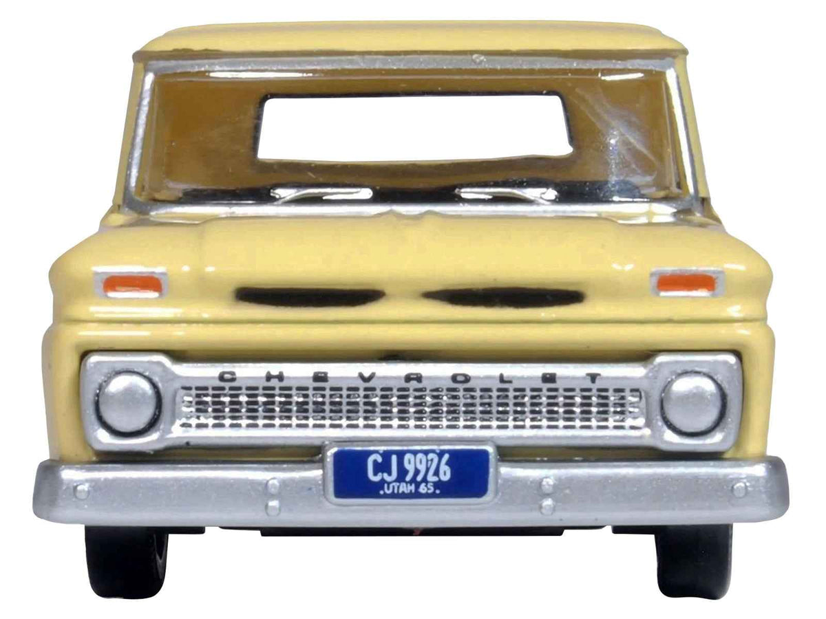 Yellow 1965 Chevrolet C10 Stepside Pickup Truck diecast model by Oxford Diecast, 1/87 scale, detailed miniature collectible.