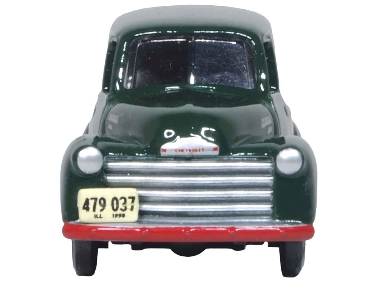Dark green 1950 Chevrolet Panel Van model by Oxford Diecast, HO scale diecast car featuring Railway Express Agency branding.