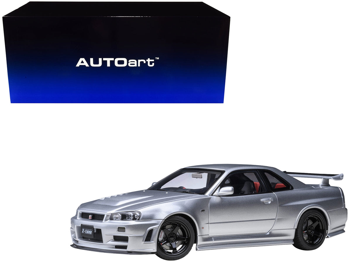 Silver metallic Nissan Nismo R34 GT-R Z-TUNE 1/18 scale model car by Autoart, detailed miniature Nissan model in right-hand drive.