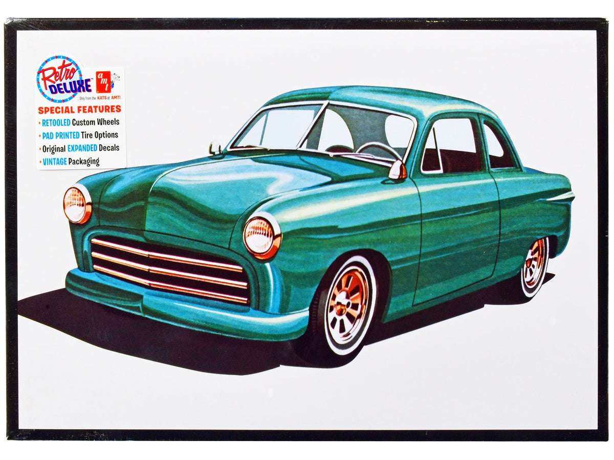 Detailed image of Miniature Motors Skill 2 Model Kit 1949 Ford Coupe "The 49'er" 1/25 scale model by AMT, showing assembled car details.