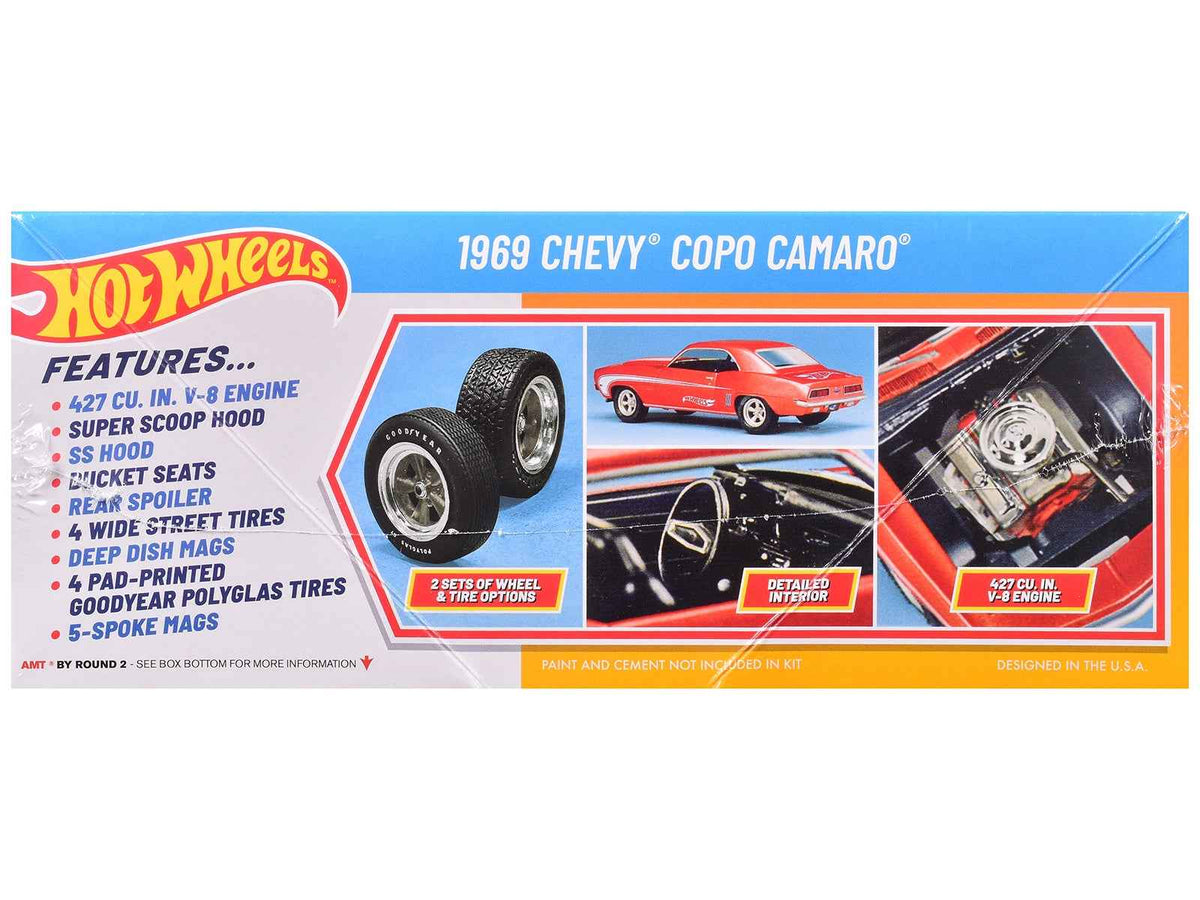 Detailed image of the Skill 2 Model Kit 1969 Chevrolet COPO Camaro 1/25 scale model by AMT, featuring vibrant paint and detailed design.