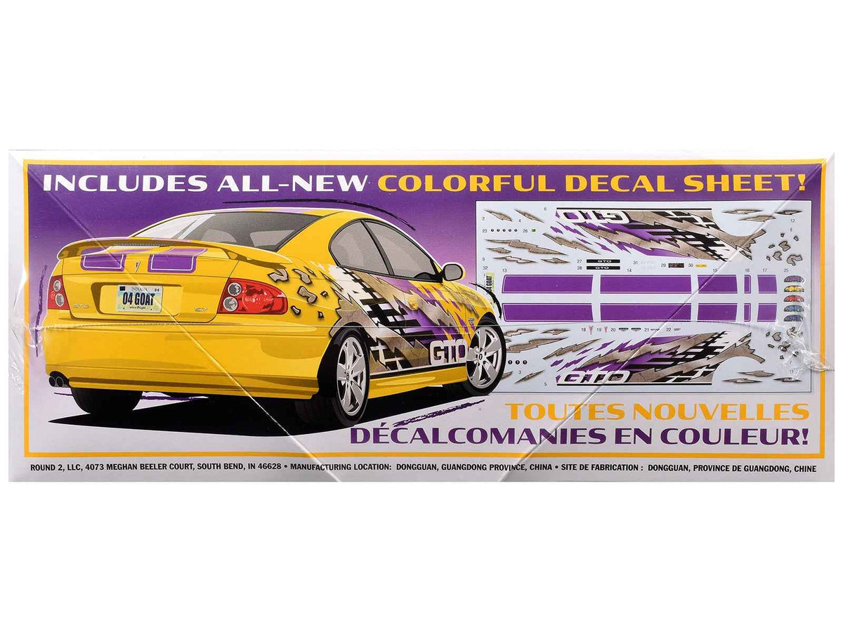 Detailed 1/25 scale Pontiac GTO model kit by AMT from Miniature Motors, featuring realistic design and intricate craftsmanship.
