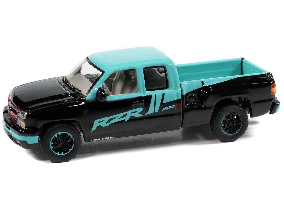 Black and blue 2006 Chevrolet Silverado pickup truck diecast model by Auto World, part of the 2025 Big Country Collectibles series.