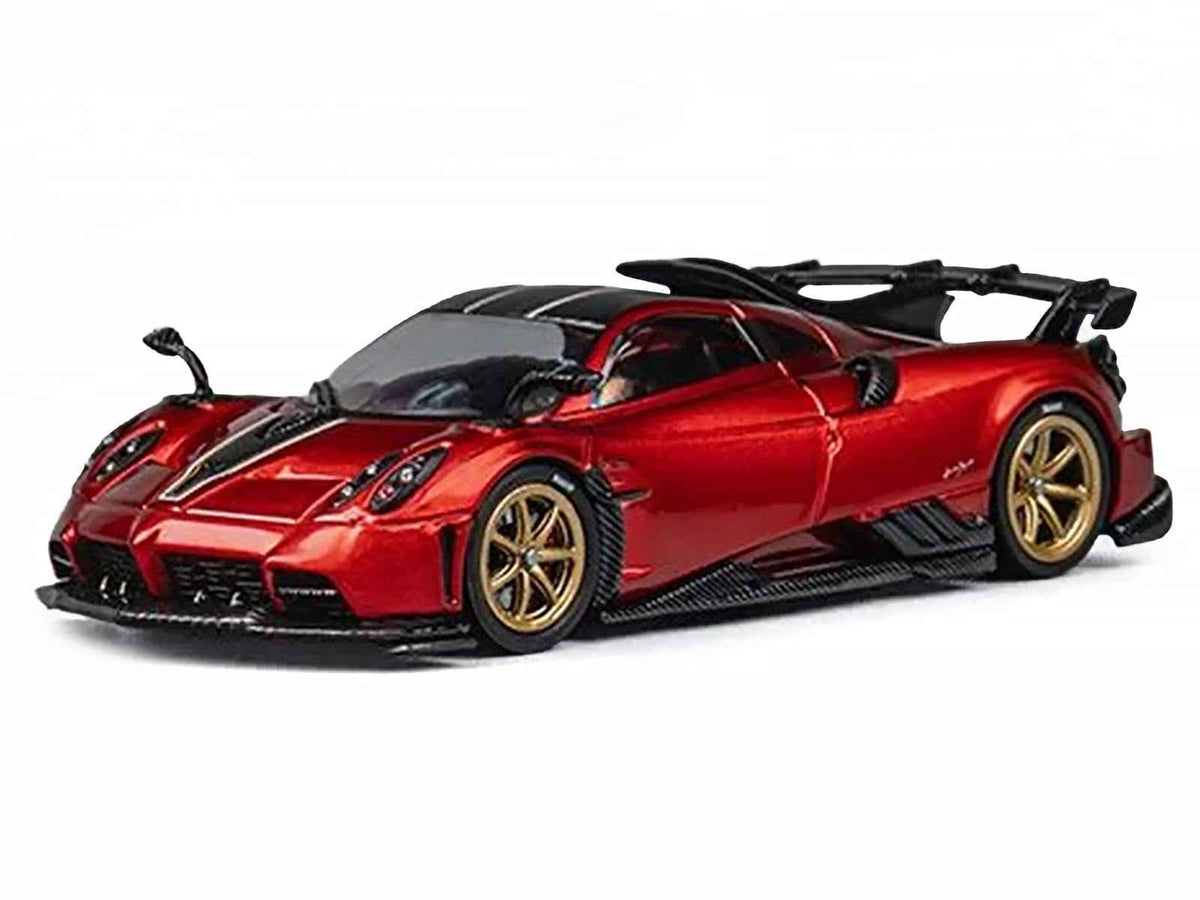 Red metallic Pagani Imola 1/64 diecast model car with carbon top, stripes, and extra wheels by Miniature Motors, detailed and realistic.