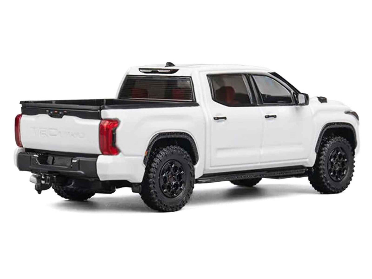 White Toyota Tundra pickup truck diecast model by Miniature Motors, detailed 1/64 scale toy car for collectors.