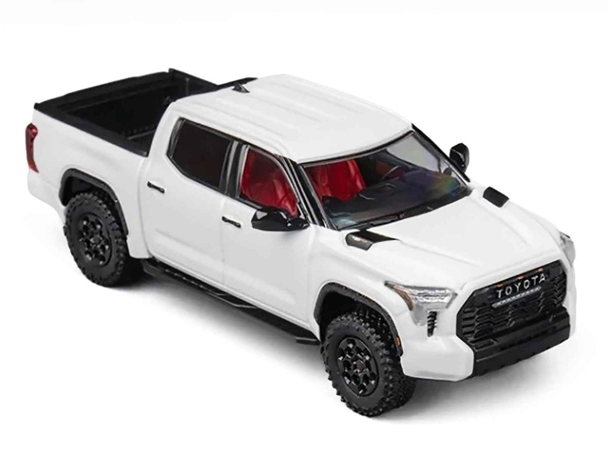 White Toyota Tundra 1/64 diecast pickup truck model by Miniature Motors, detailed toy car for collectors and displays.