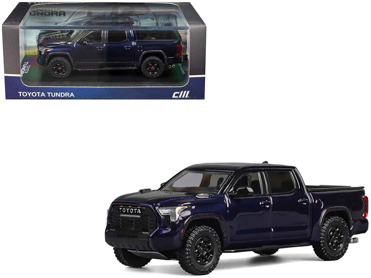 Dark blue metallic Toyota Tundra 1/64 diecast model truck by Miniature Motors, detailed miniature pickup truck with realistic features.