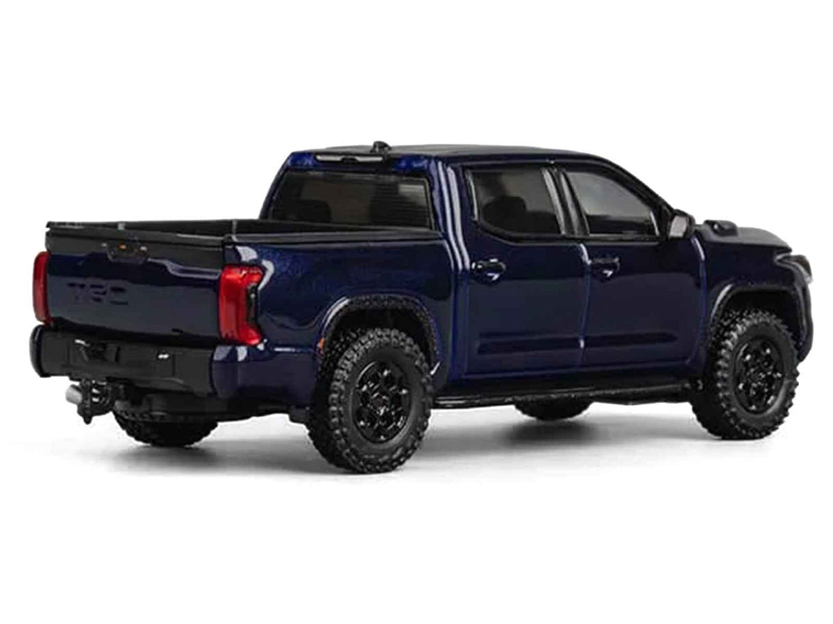 Dark blue metallic Toyota Tundra 1/64 diecast model truck by Miniature Motors, detailed miniature pickup car from Toyota models collection.