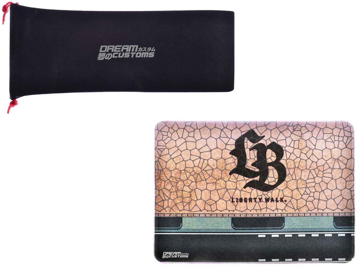 Miniature Motors Desktop Display Mat featuring the "LB" logo by Dream Customs, perfect for showcasing accessories.