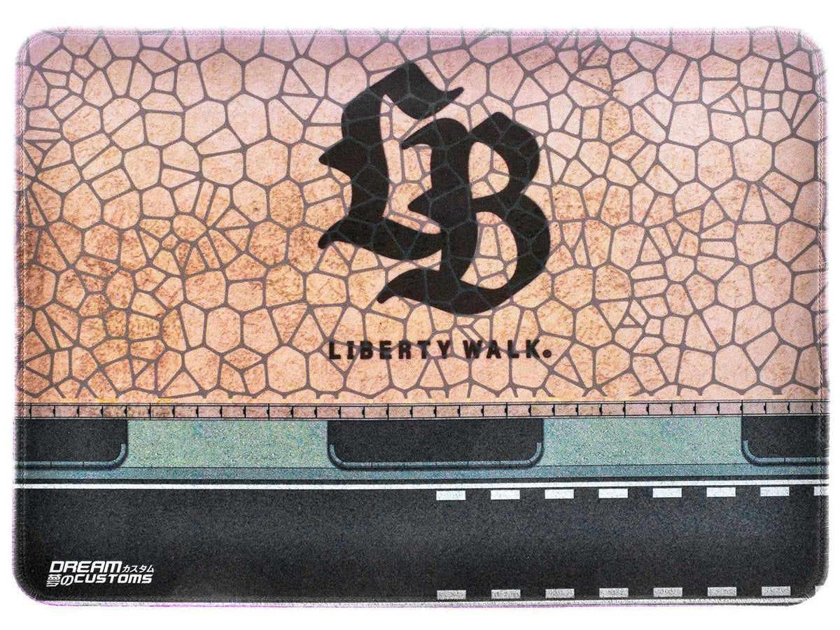 Miniature Motors desktop display mat featuring the Dream Customs "LB" logo, accessory with detailed branding and design.