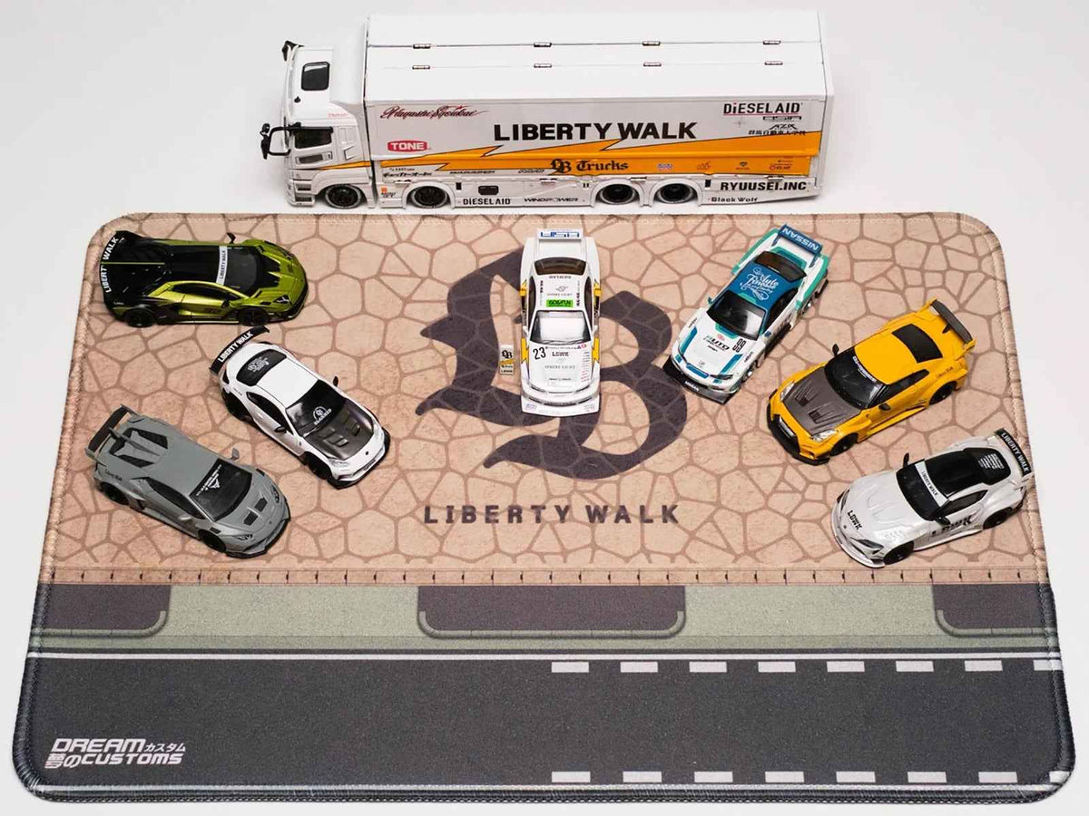 Miniature Motors Desktop Display Mat featuring the LB logo by Dream Customs, designed as a stylish accessories display pad.