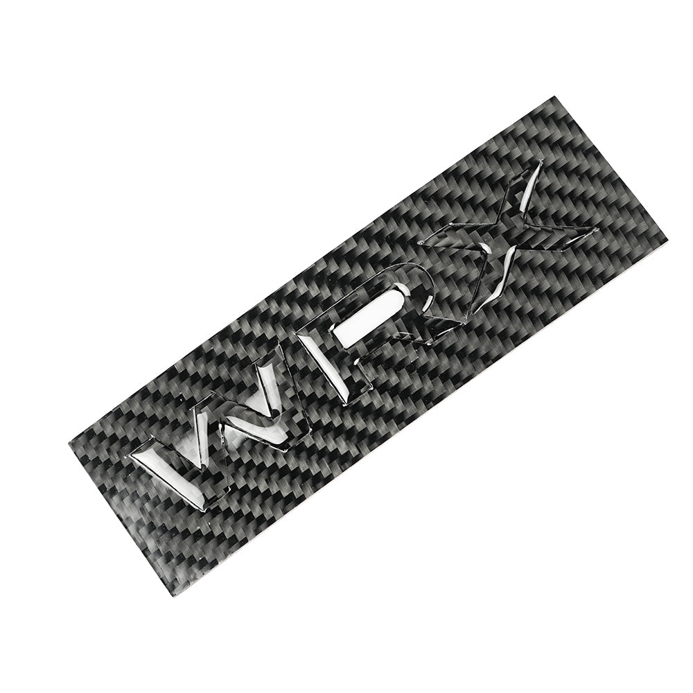 Racing Art carbon fiber trunk emblem for 2022-2025 Subaru WRX, JDMuscle ornament with sleek black finish and detailed logo.