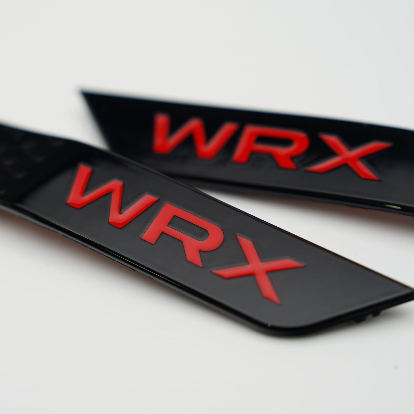 JDMuscle Racing Art 15-21 WRX/STI Fender Emblems, automotive ornaments with bold racing design for Subaru WRX and STI models.