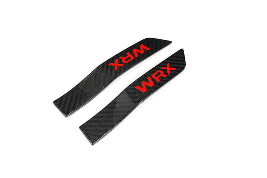 JDMuscle Tanso Carbon Fiber Fender Emblem V2 on a 2015-2021 Subaru WRX/STI, close-up view of the emblem on the car's fender.