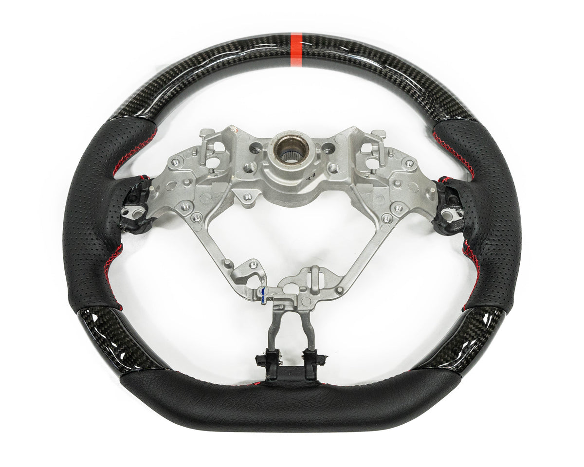 FactionFab carbon and leather steering wheel for 2017+ Subaru BRZ and Toyota 86, featuring sporty design and high-quality materials.