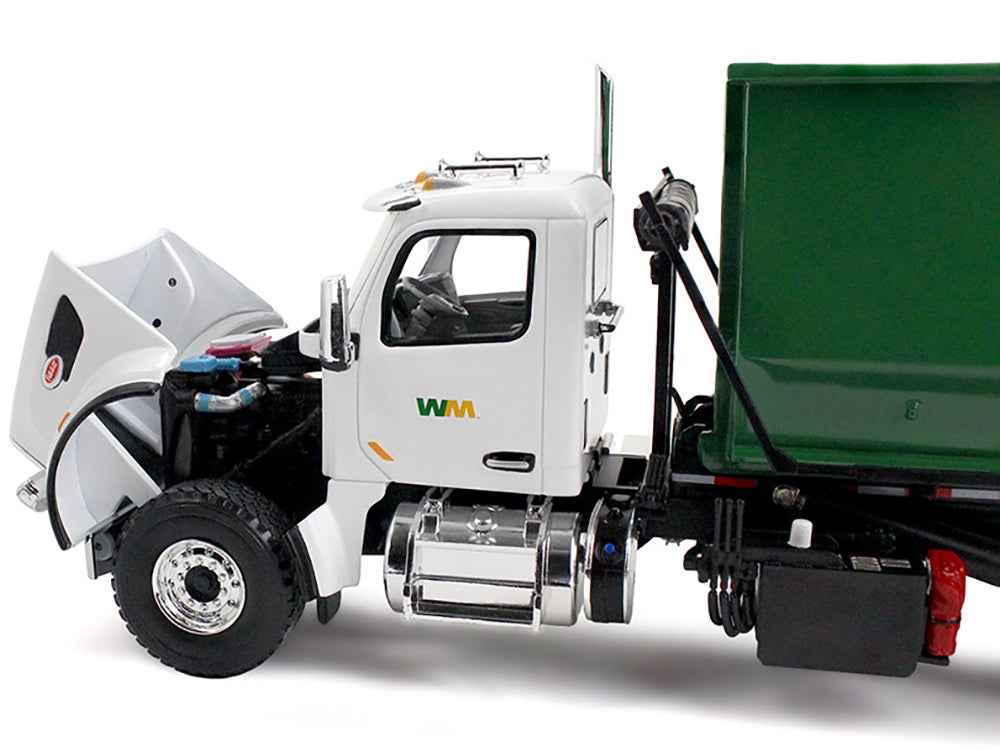 Miniature Motors Peterbilt 567 refuse garbage truck diecast model with white and green 40-yard roll-off container, detailed scale model.
